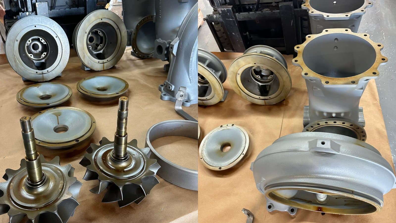 Overhauled turbocharger parts laid out on a bench: shafts, compressor wheels, casings and seal plates